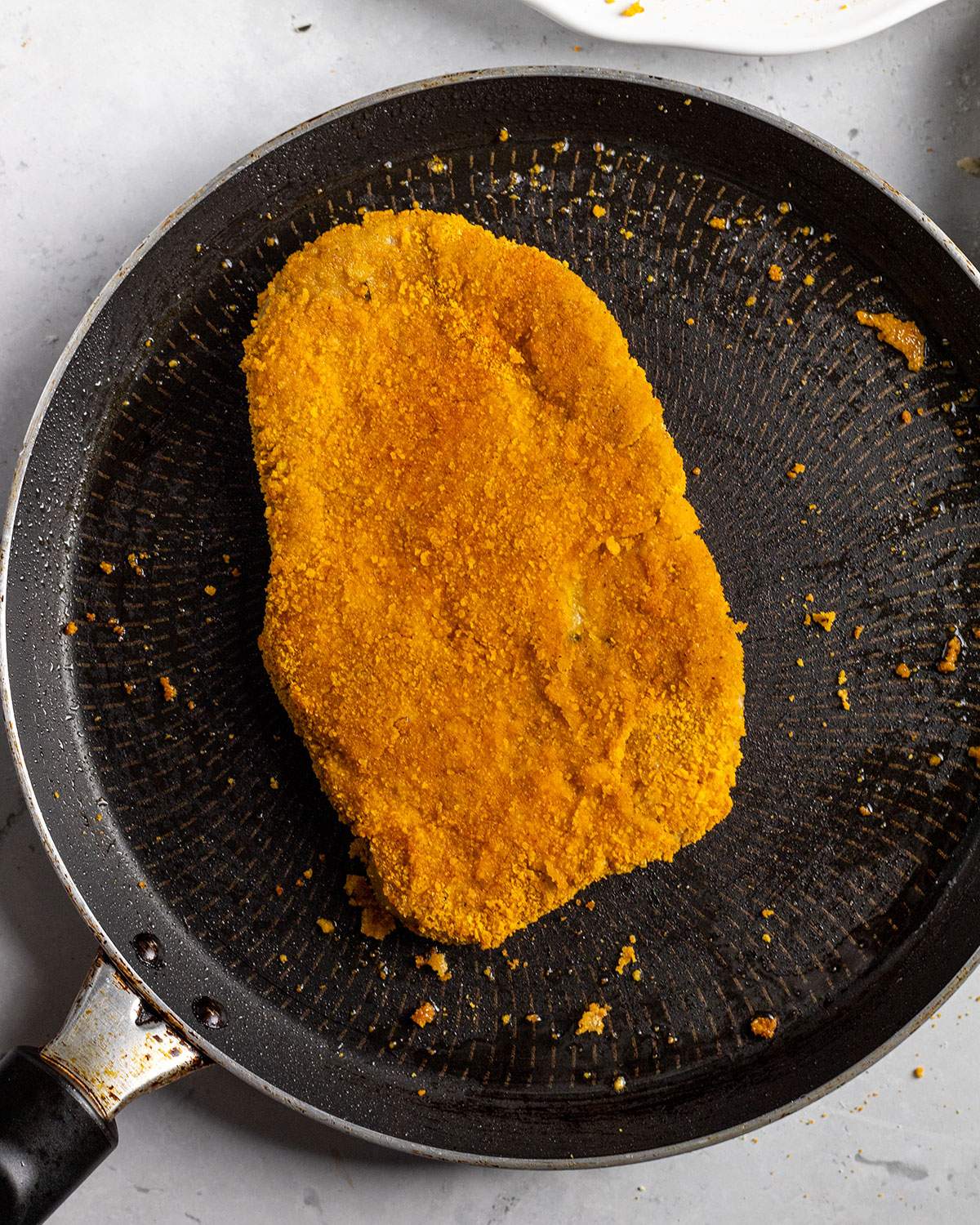 fried vegan schnitzel in a skillet