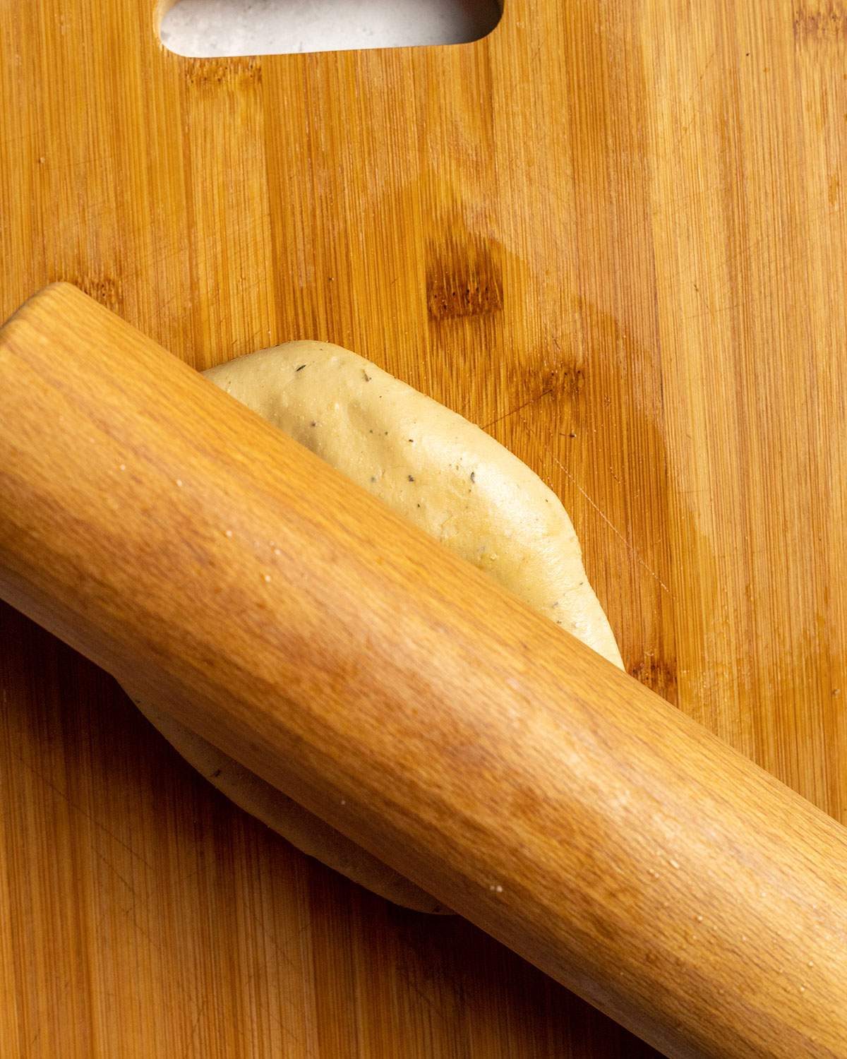 rolling seitan dough with a rolling pin