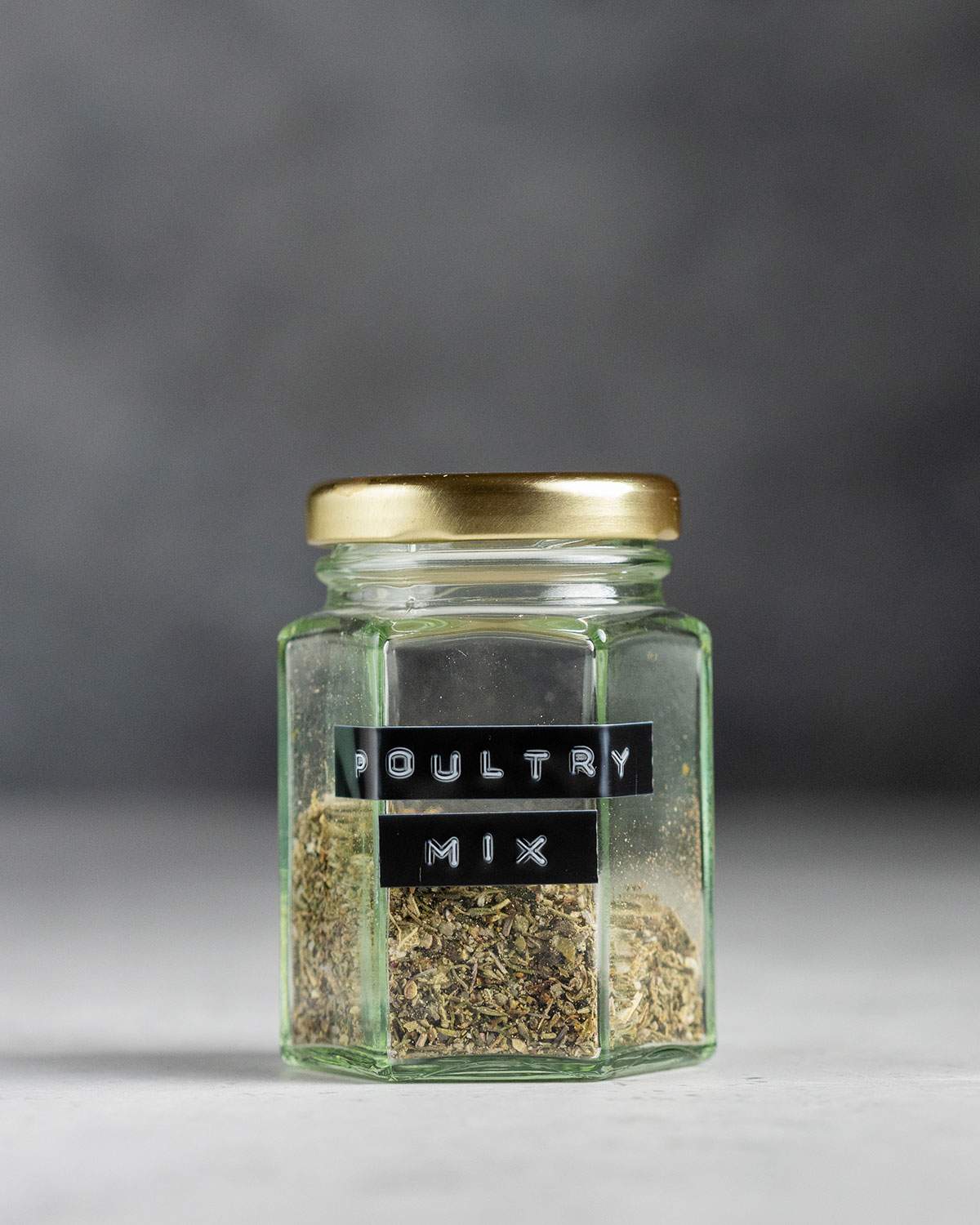 vegan poultry seasoning mix in a glass jar