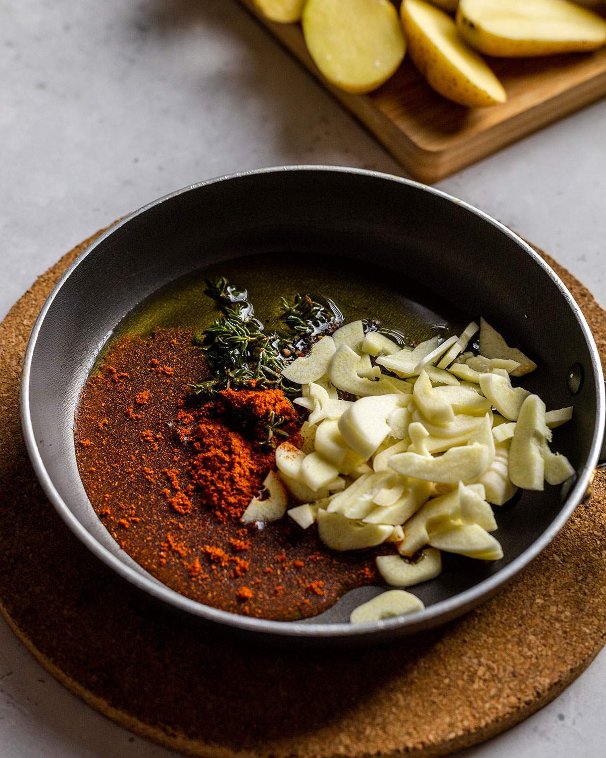 uncooked ingredients for flavor oil in a small pan