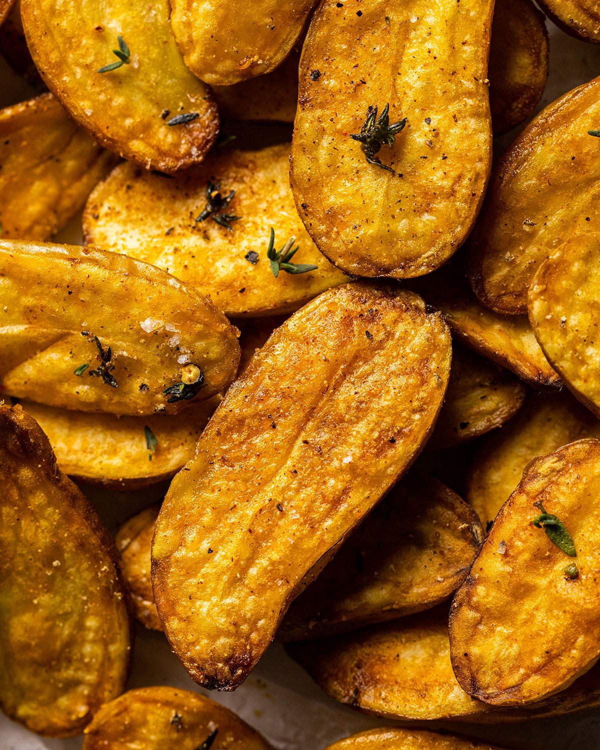 close up image of fried fingerling potatoes