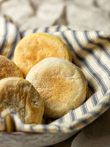 4 vegan english muffins in a bowl