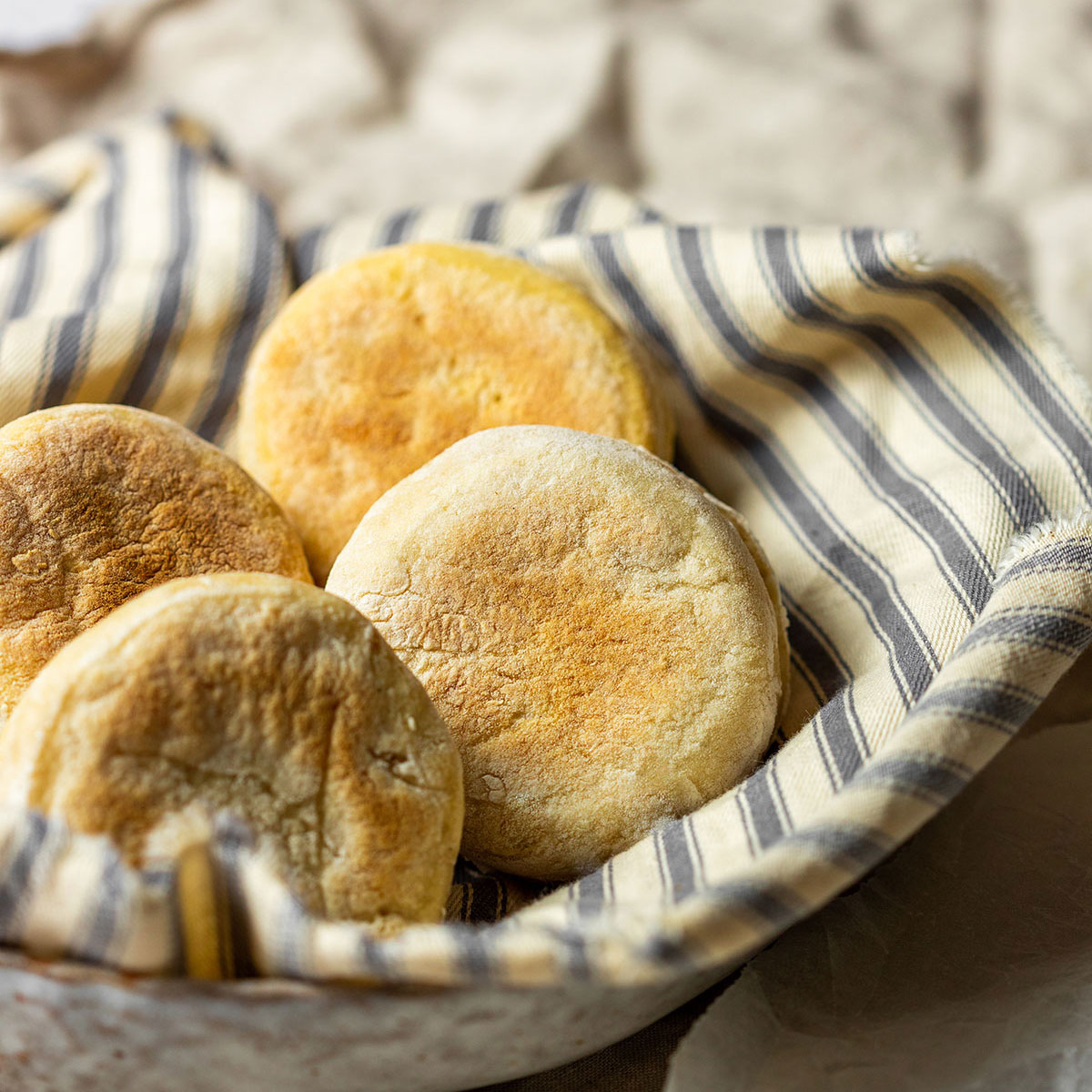 4 vegan english muffins in a bowl