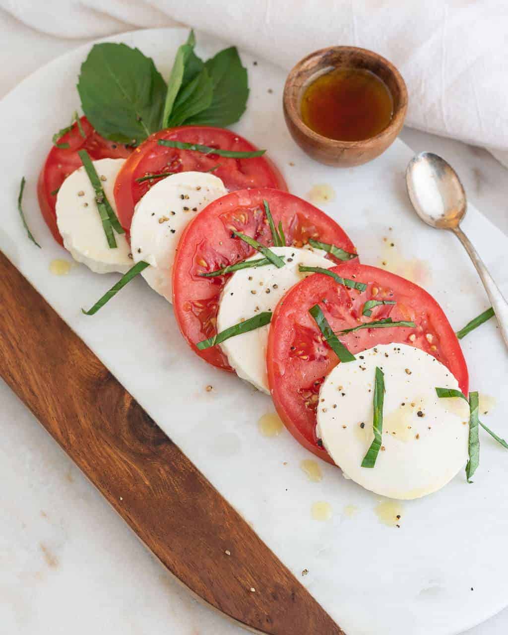 silken tofu and tomato caprese salad on a serving platter