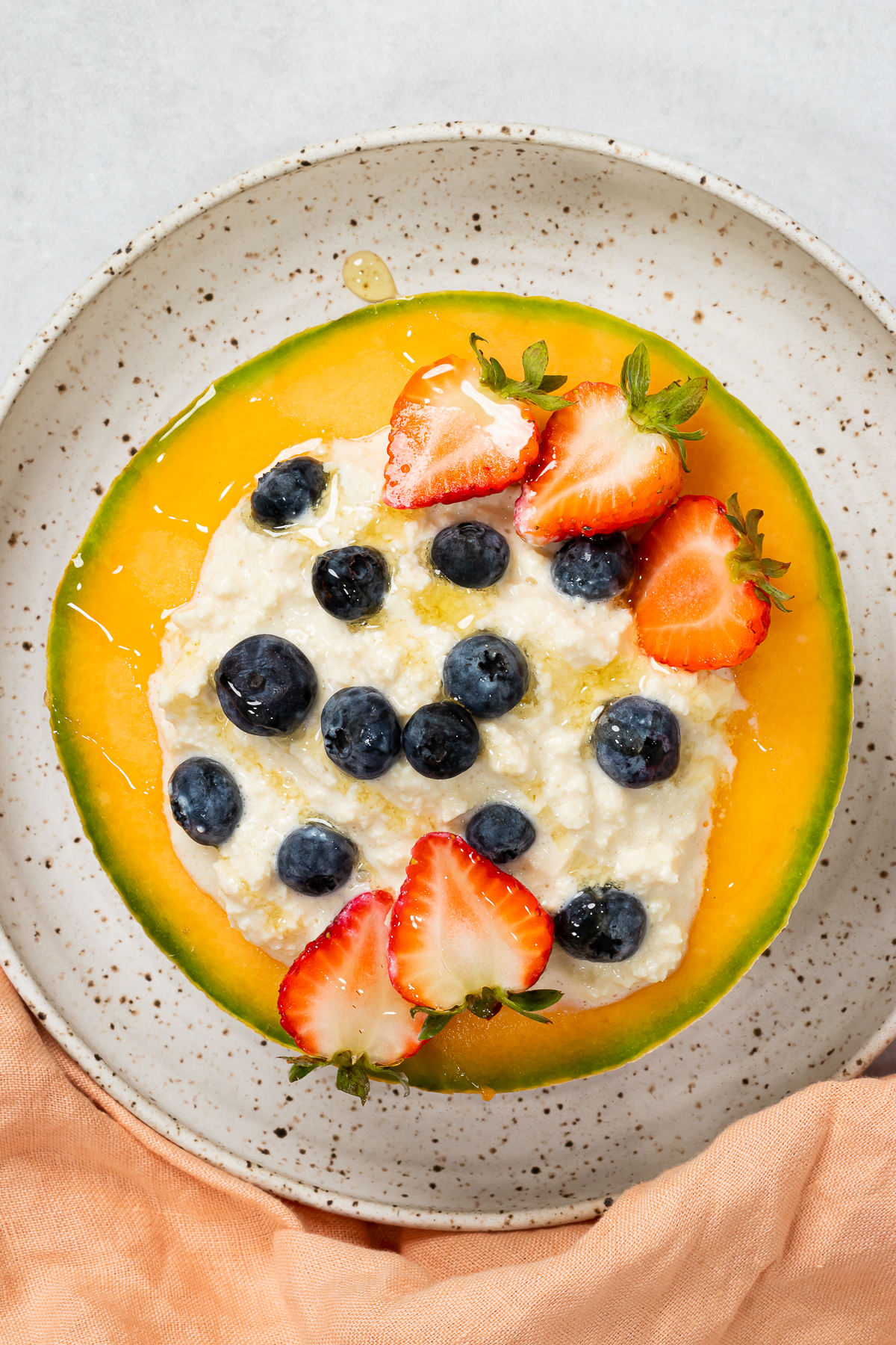 vegan tofu cottage cheese on top of a slice of fruit