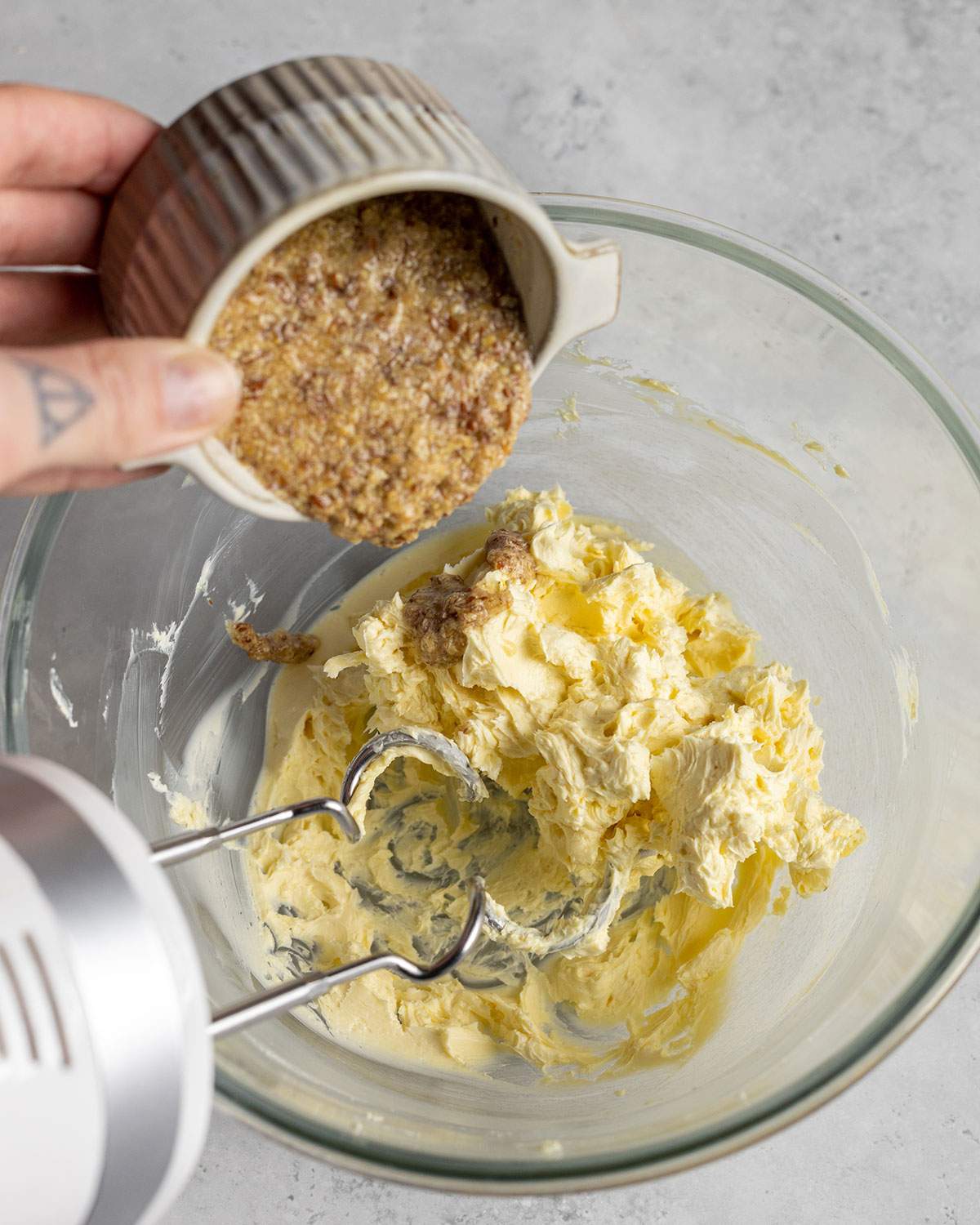 adding a flax egg into beaten vegan butter