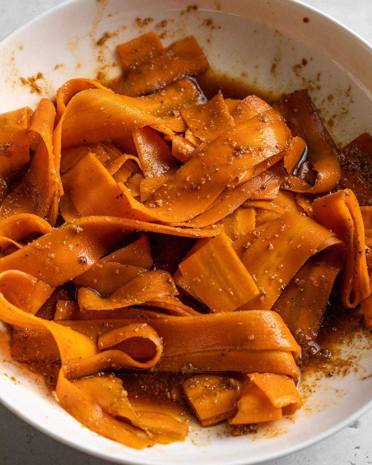 carrot slices marinating for vegan carrot bacon