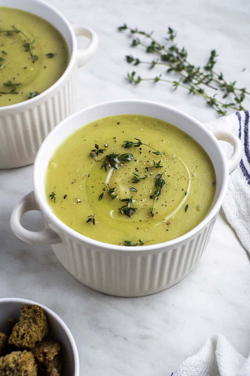 a small soup bowl filled with vegan potato leek soup