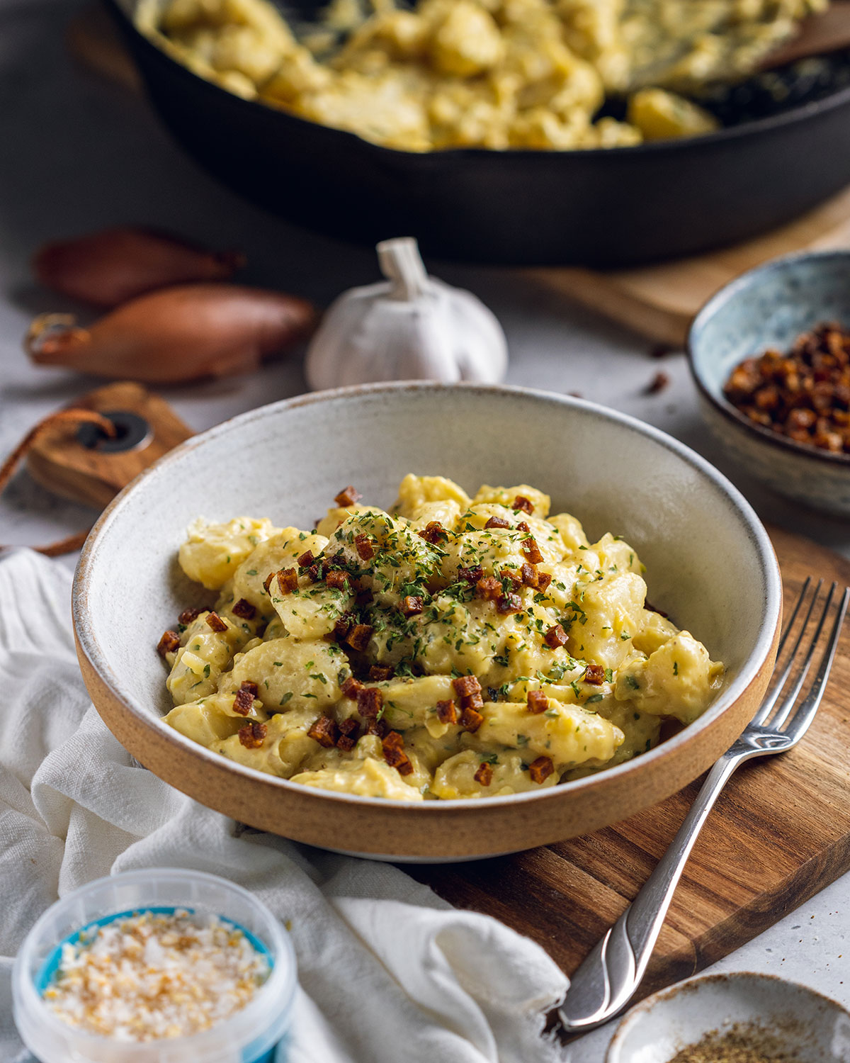 gnocchi carbonara in a white bowl