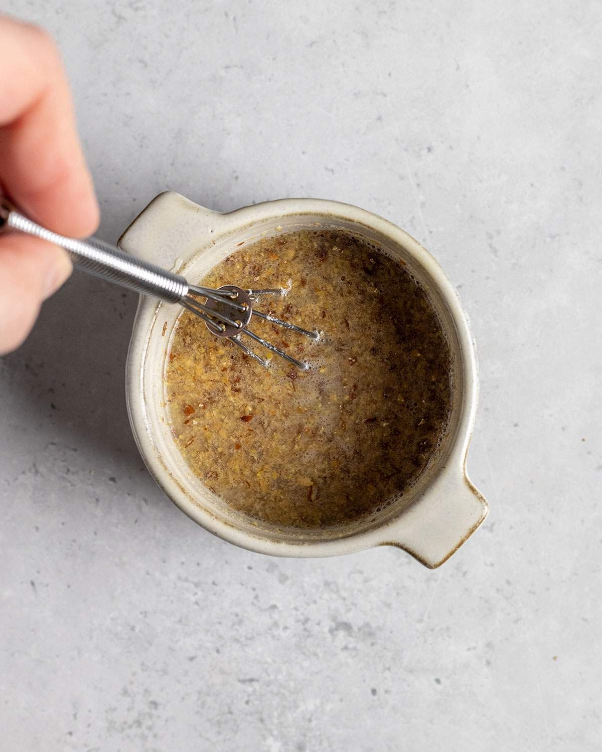 mixing flaxeggs in a small bowl