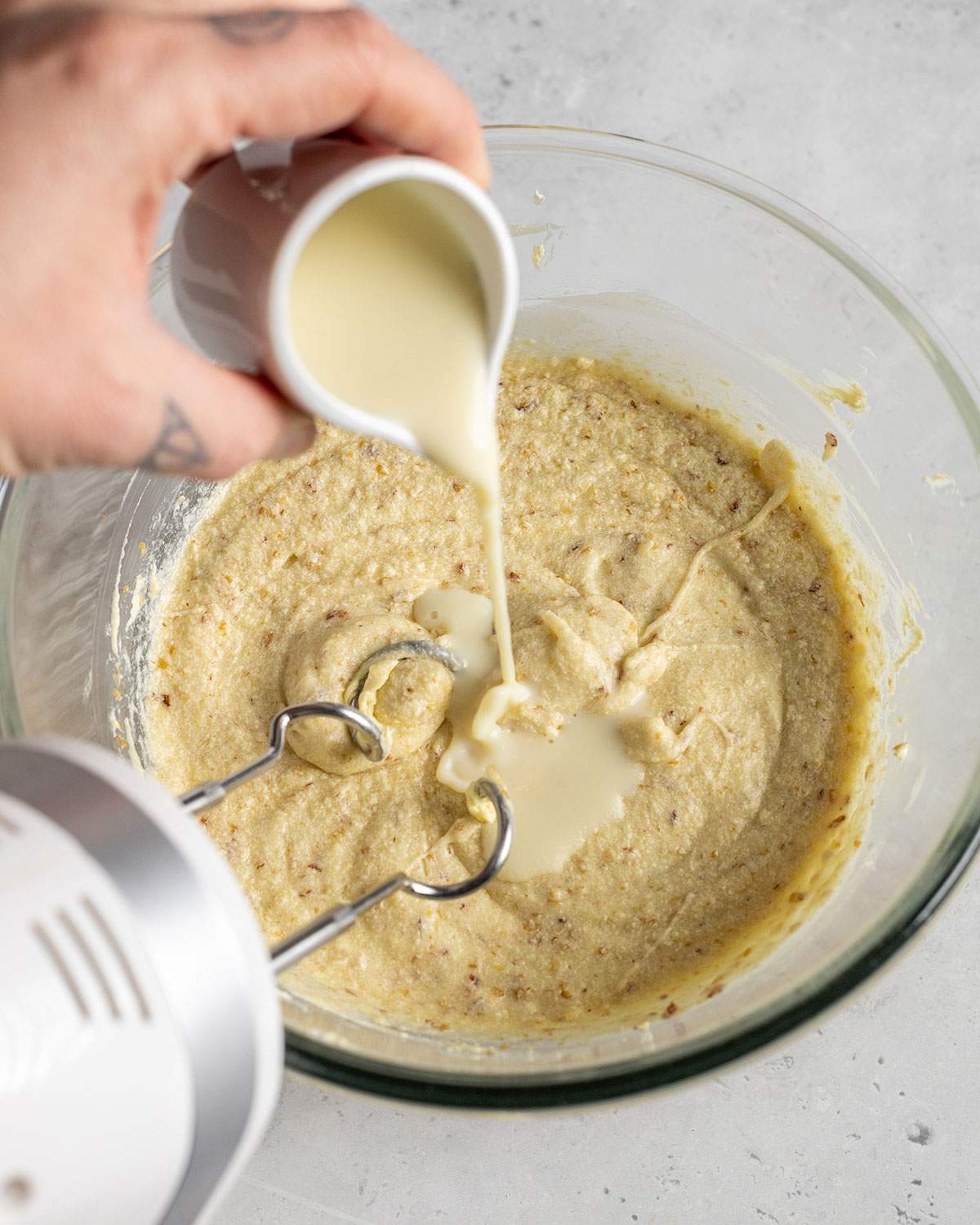 pouring plant milk into waffle batter