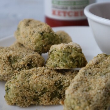 broccoli tater tots on a white plate with ketchup