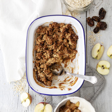 vegan breakfast crumble in a rectangular oven dish with a spoon on the side