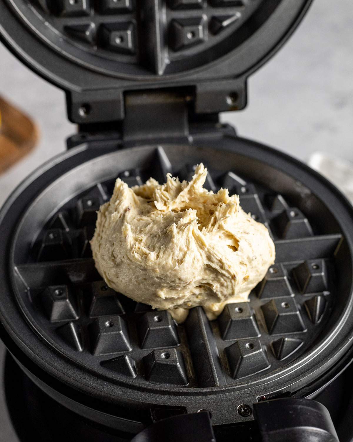 vegan waffle batter on a waffle maker