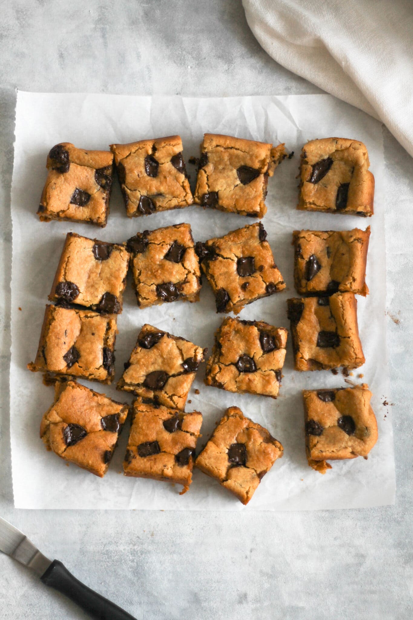 vegan chickpea blondies on white parchment paper