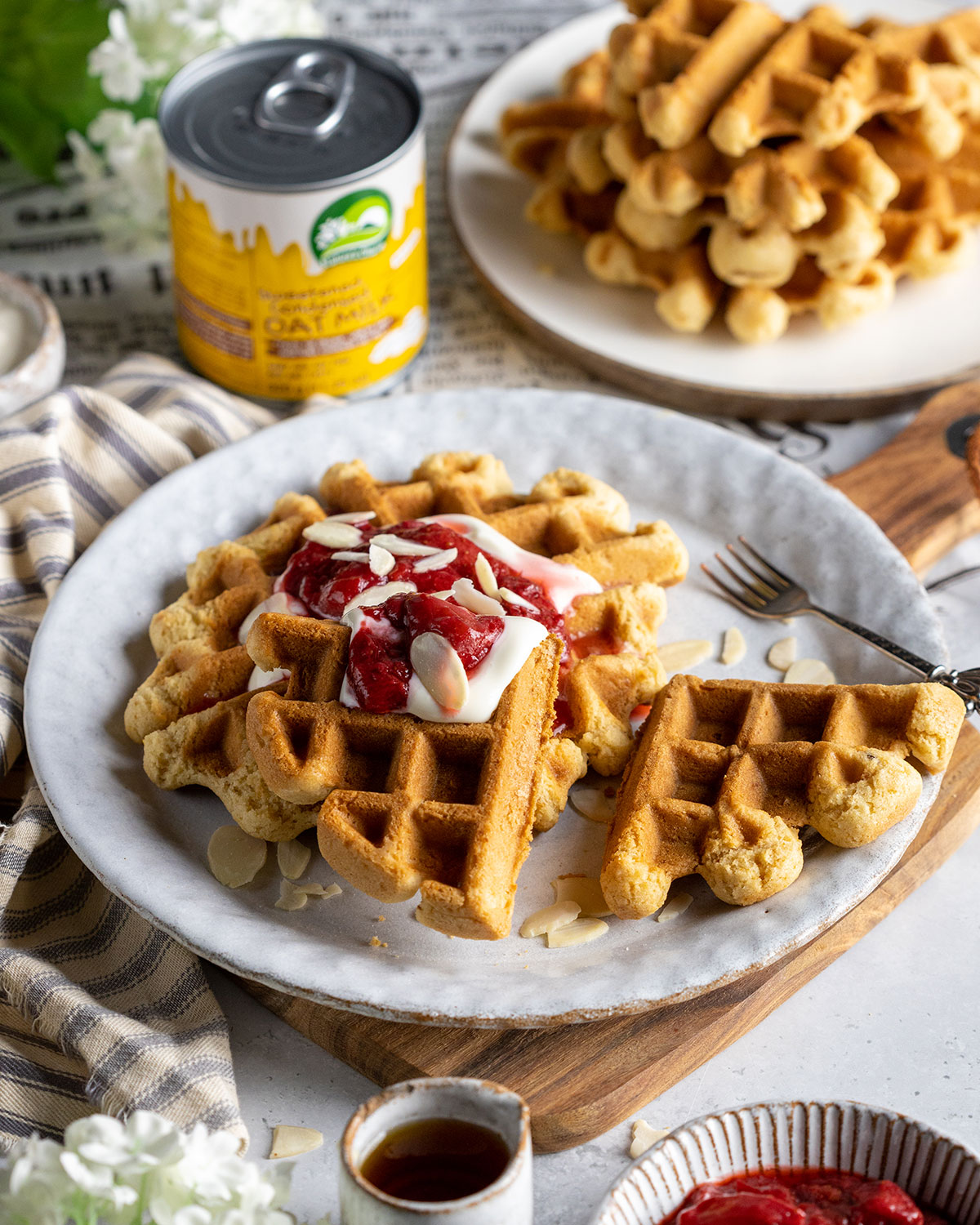 vegan condensed milk waffles on a white plate on the breakfast table