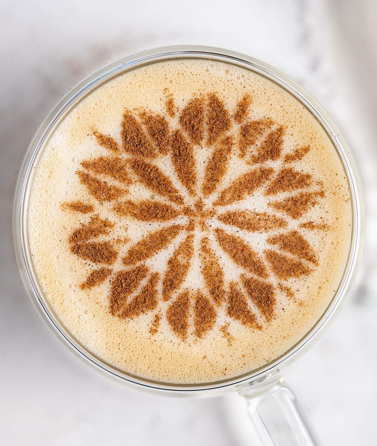 cinnamon flower stencil on a cup of spanish latte