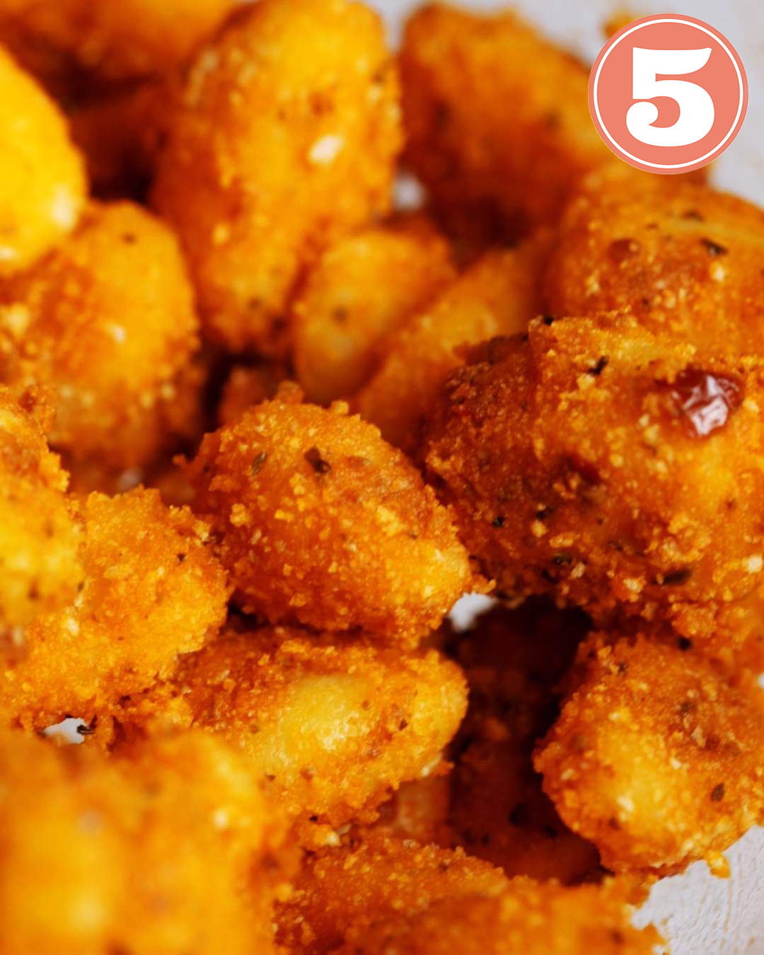 Crumb coated gnocchi in a bowl up close.