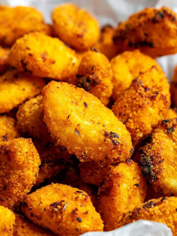 close up of crispy air fryer gnocchi in a bowl.