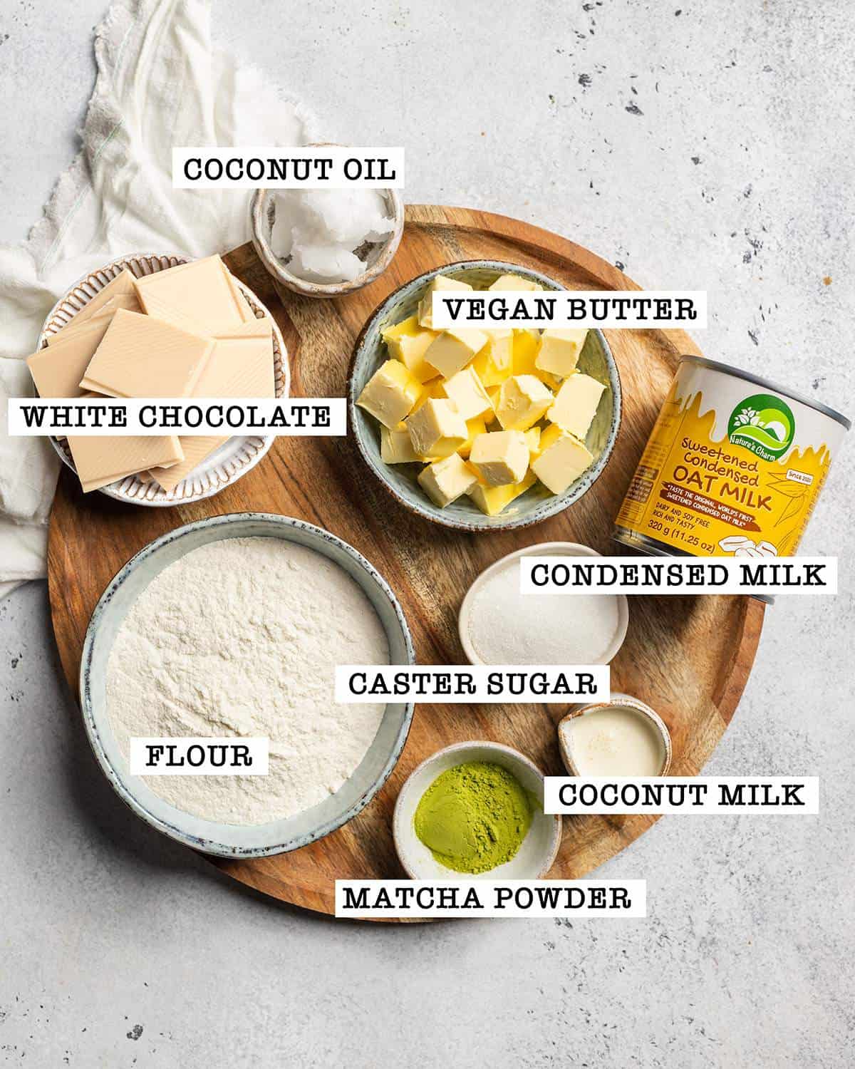 Ingredients for twix matcha bars on a serving platter with labels.