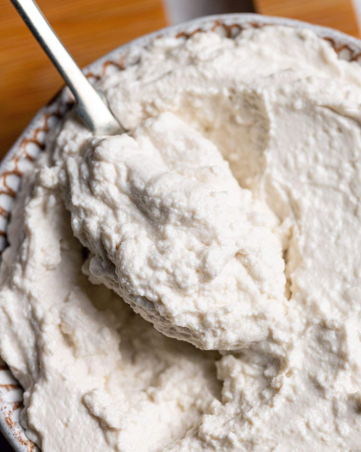 A spoonful of almond ricotta up close.