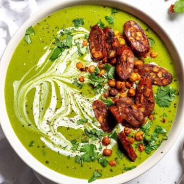 Creamy vegan pea and kale soup in a bowl.