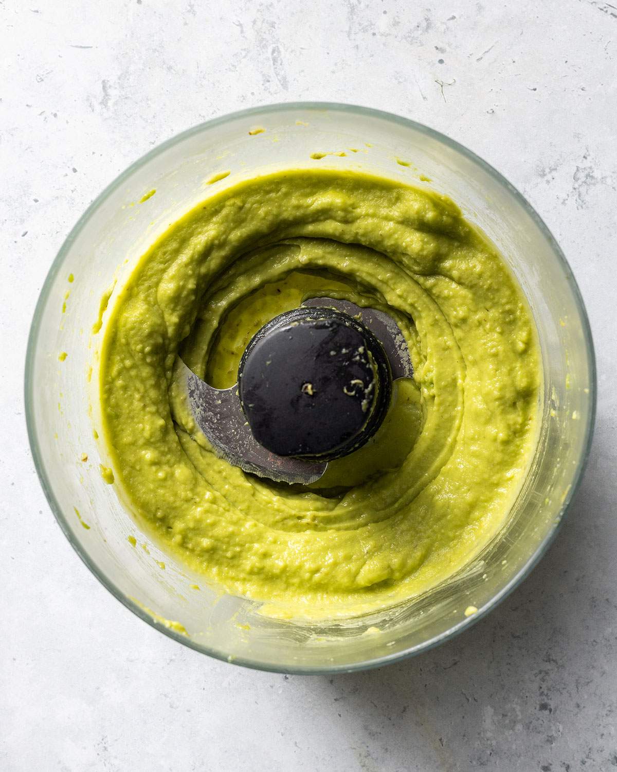 Mashed avocado in a food processor.