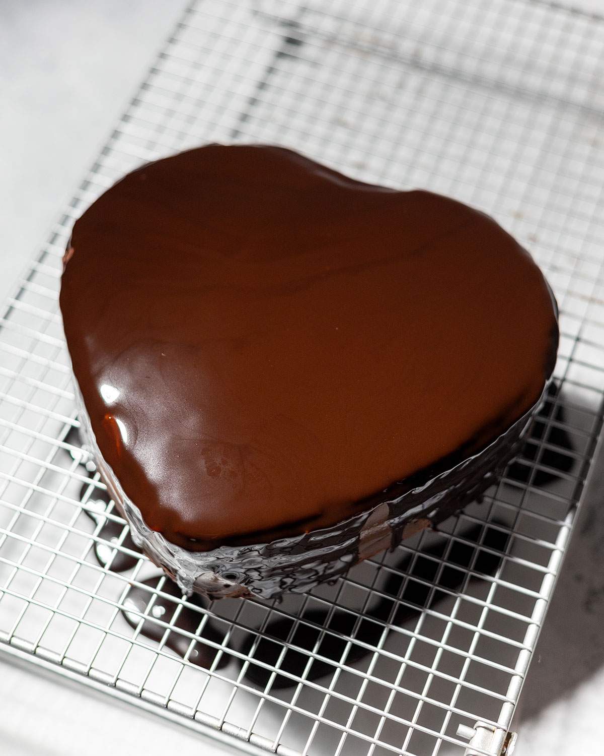 Chocolate Sauce poured over a chocolate cake as glaze.