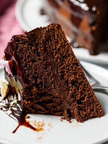 A slice of chocolate avocado cake on a plate.