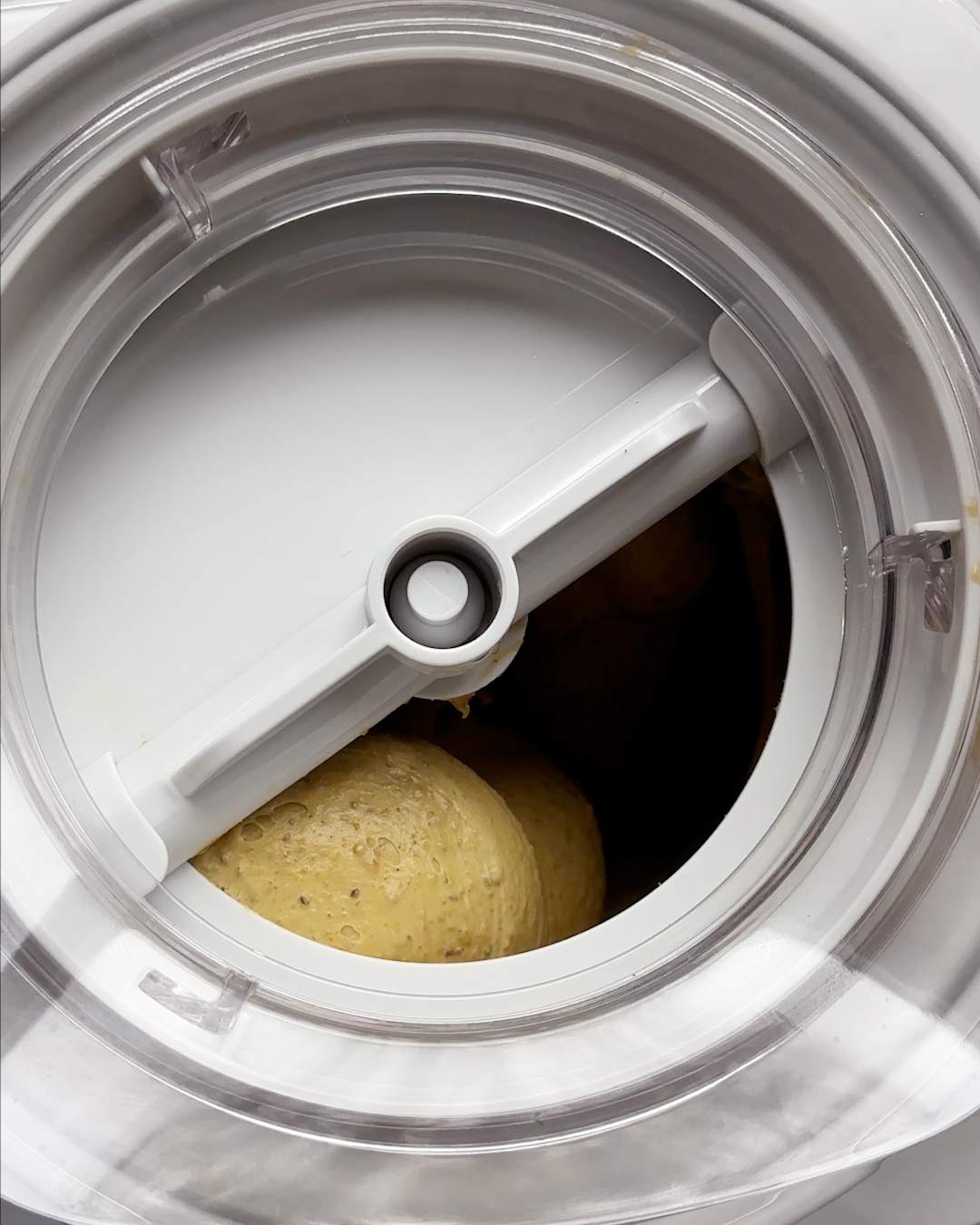 Churning ice cream in an ice cream maker.