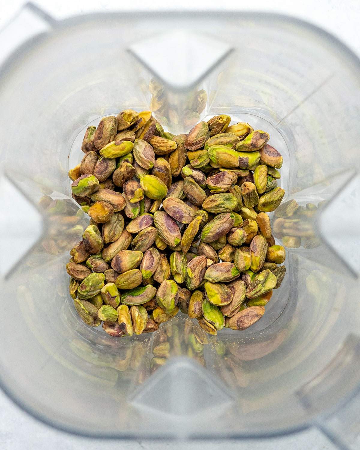 Roasted pistachios in a blender.