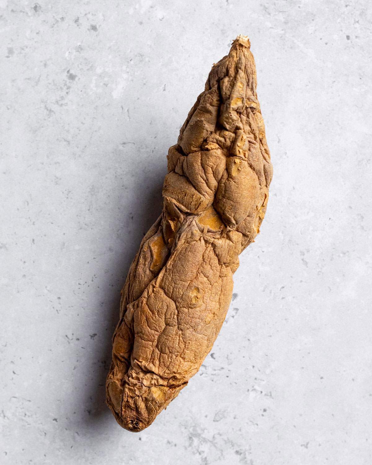 A wrinkly sweet potato up close.