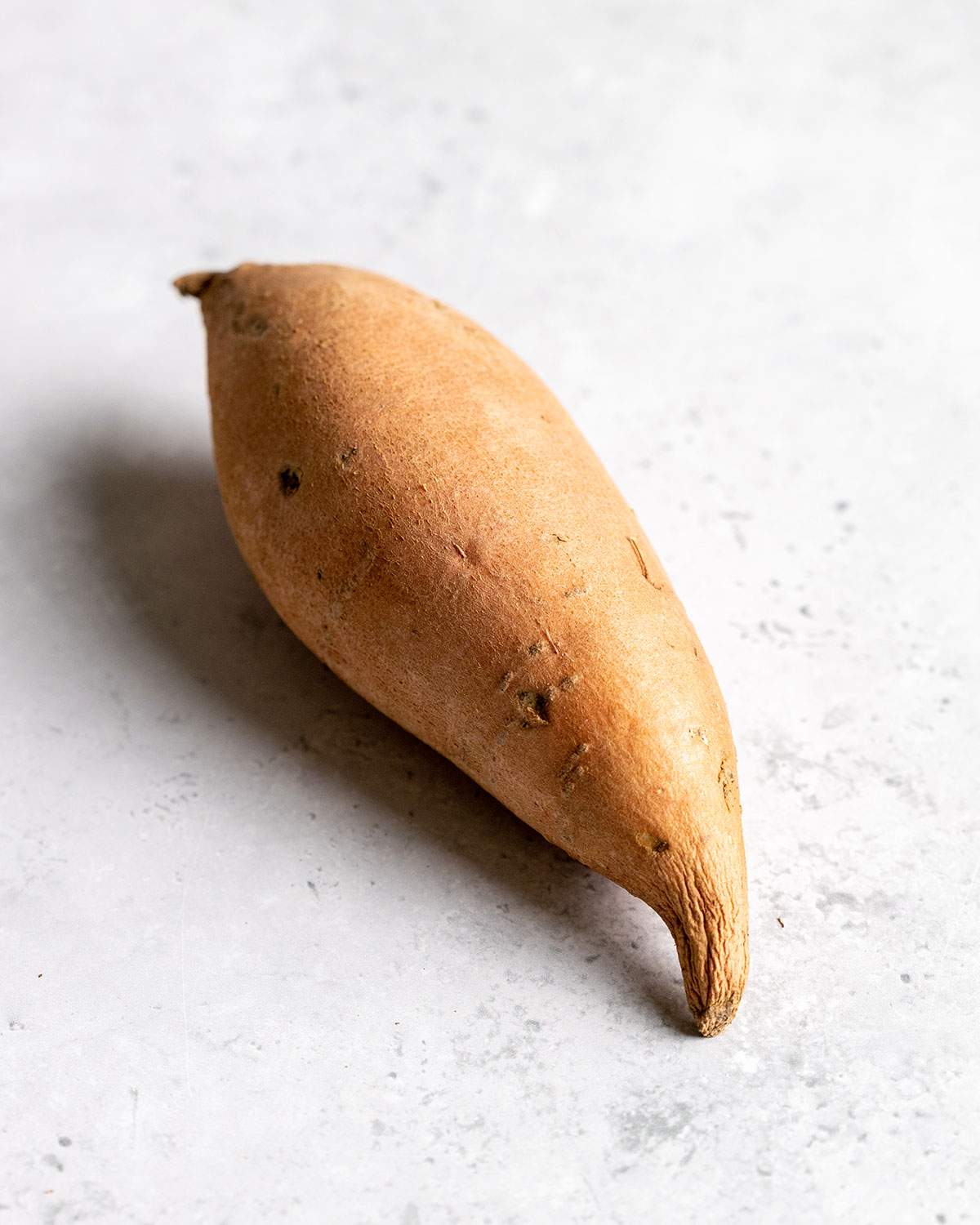 A good sweet potato with a lightly wrinkly end.