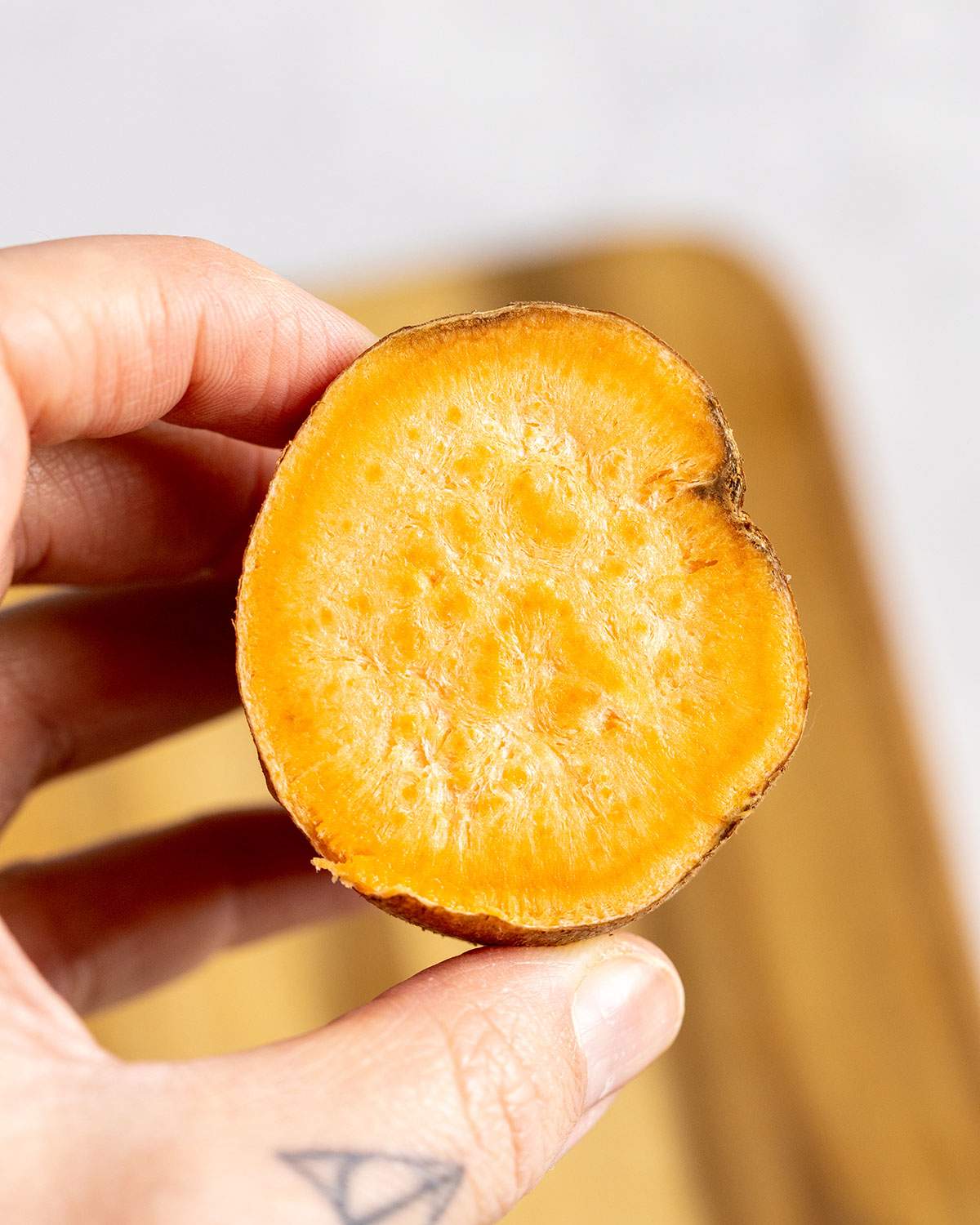 The inside of an old, dry sweet potato with fibrous centre.