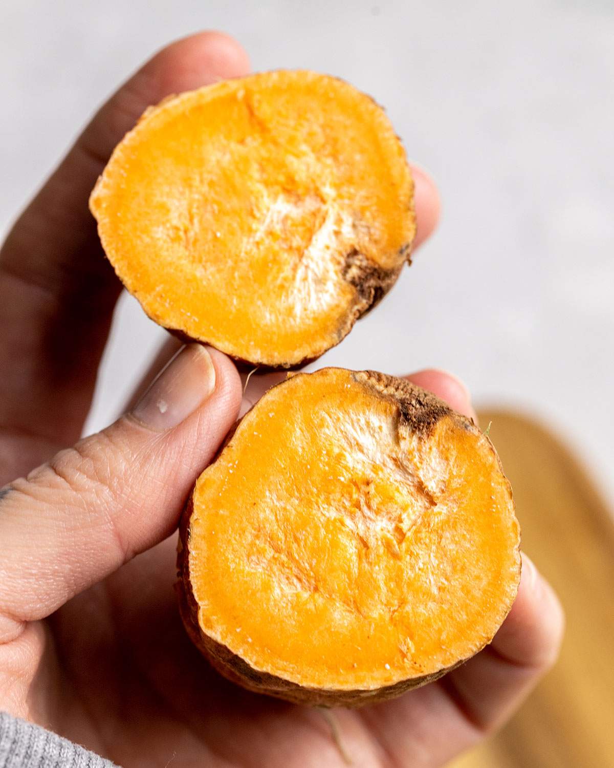 Two rotting sweet potato halves.