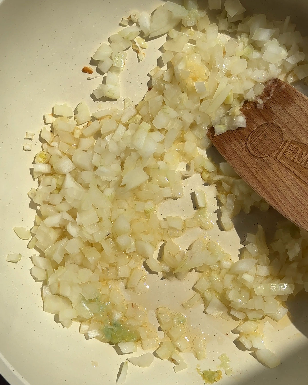 Sautéed onions and garlic in a skillet.