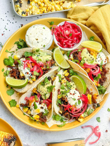 Vegan Carnitas Tacos on a serving plate.