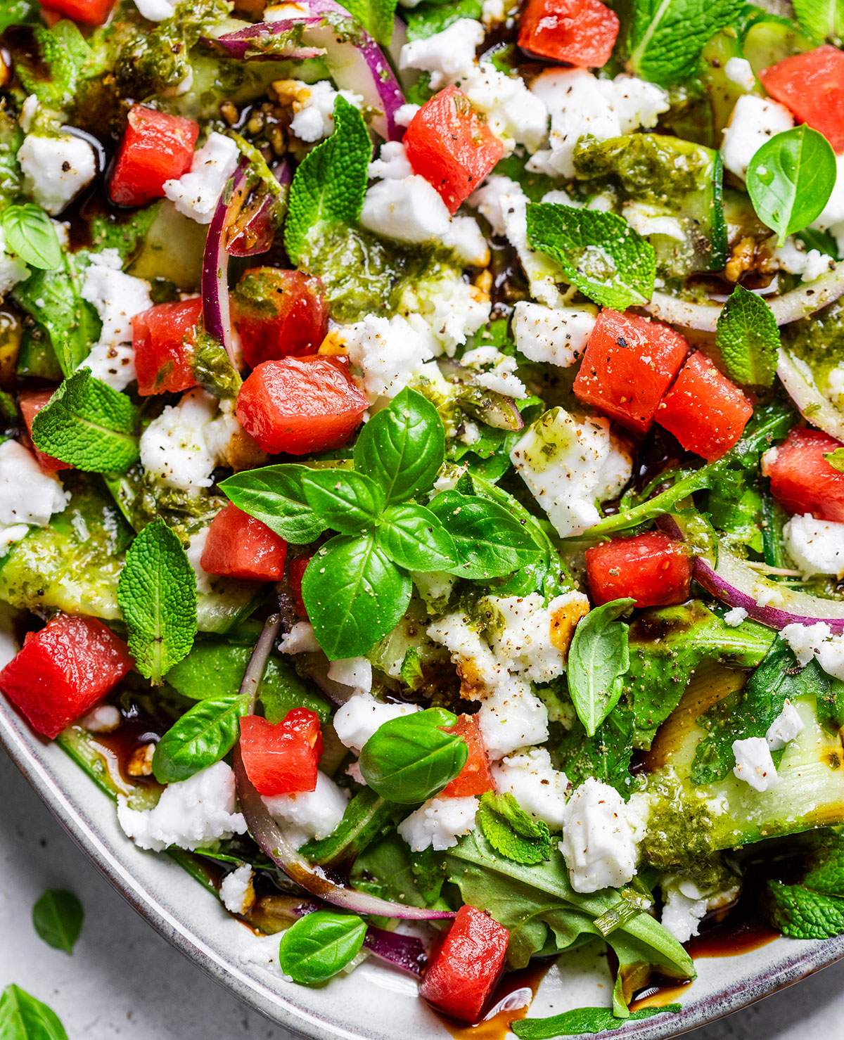 A platter filled with vegan watermelon feta salad.