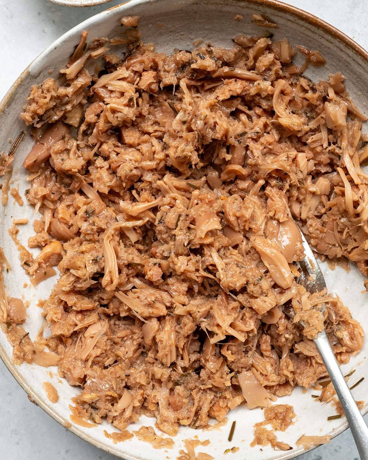 Mashed jackfruit in a bowl.