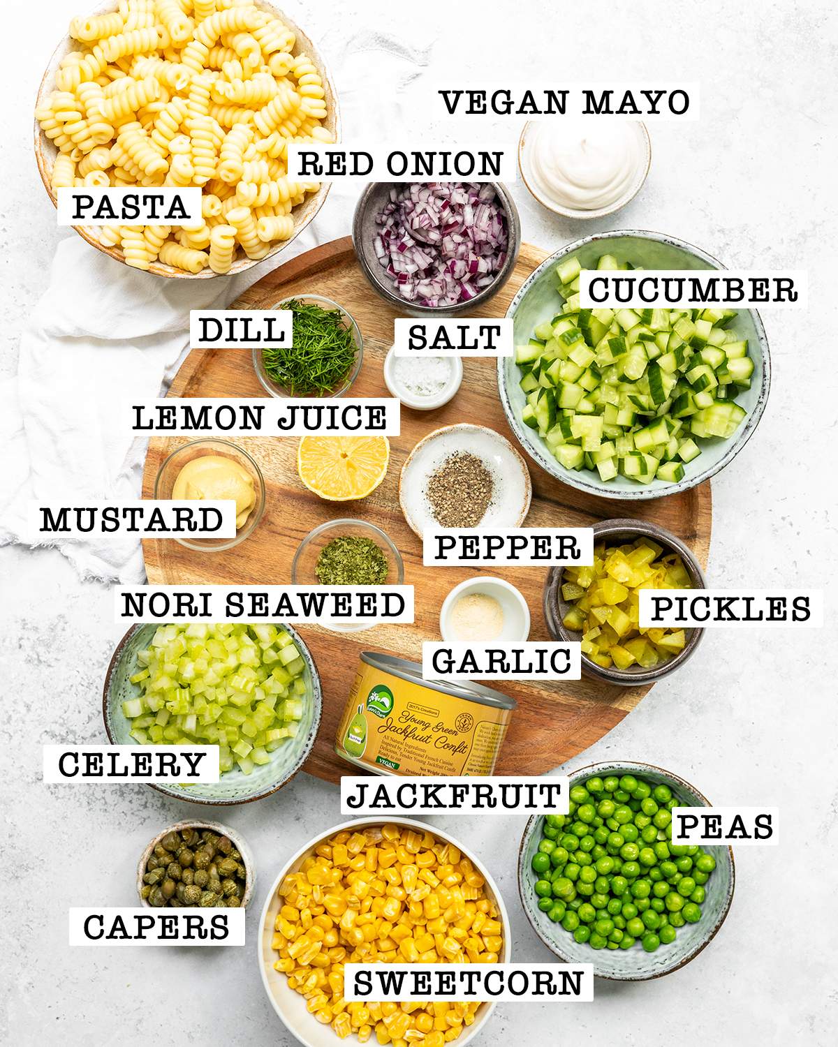 Ingredients for vegan tuna salad using jackfruit with labels next to each ingredient.
