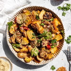 A portion of vegan big mac potato salad on a serving bowl.