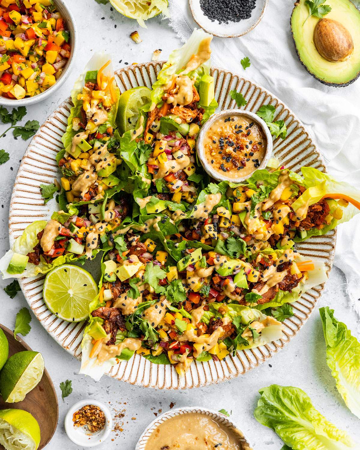 A serving platter with lettuce wraps.