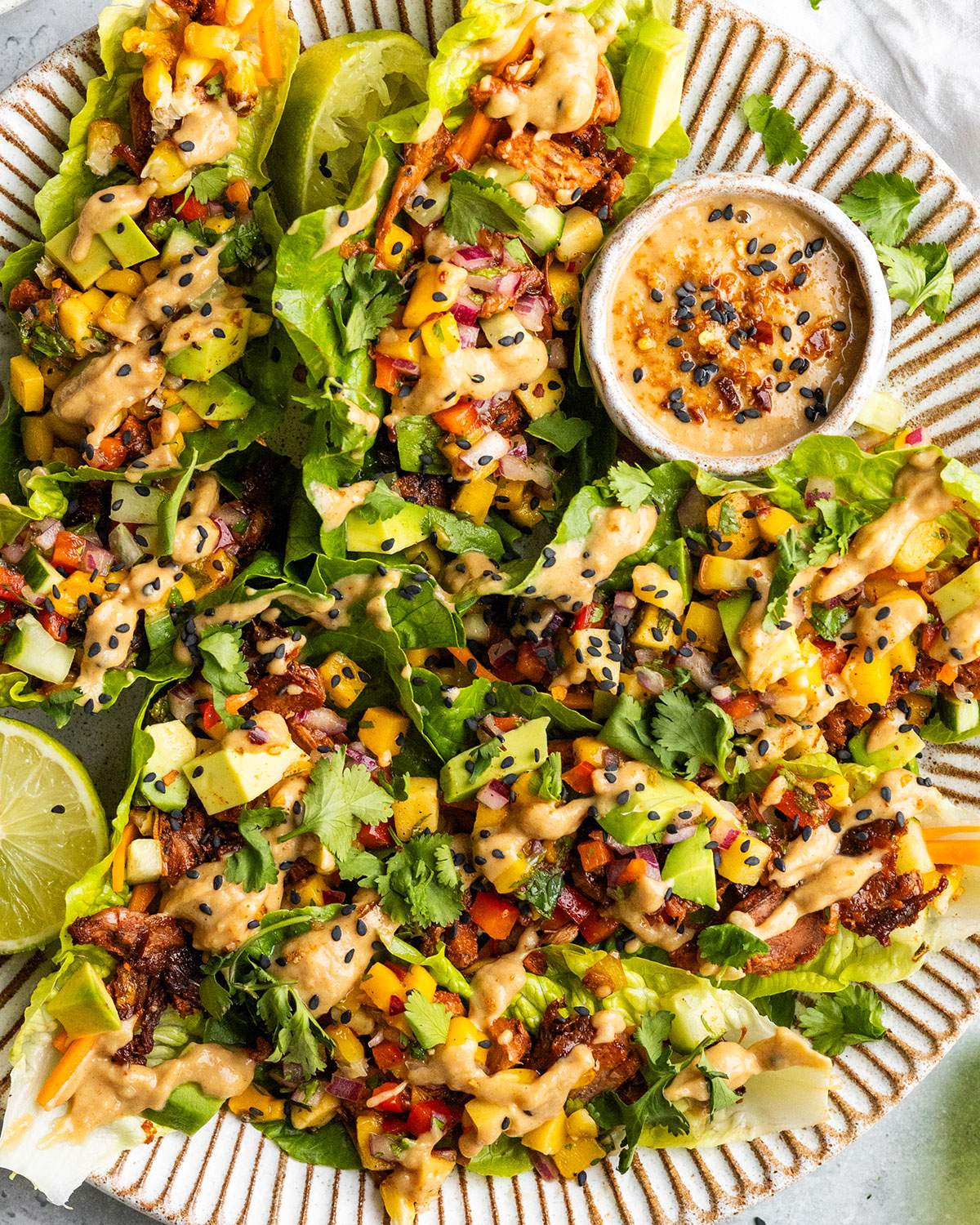 Lettuce wraps stuffed with fresh veggies and spicy jackfruit filling.