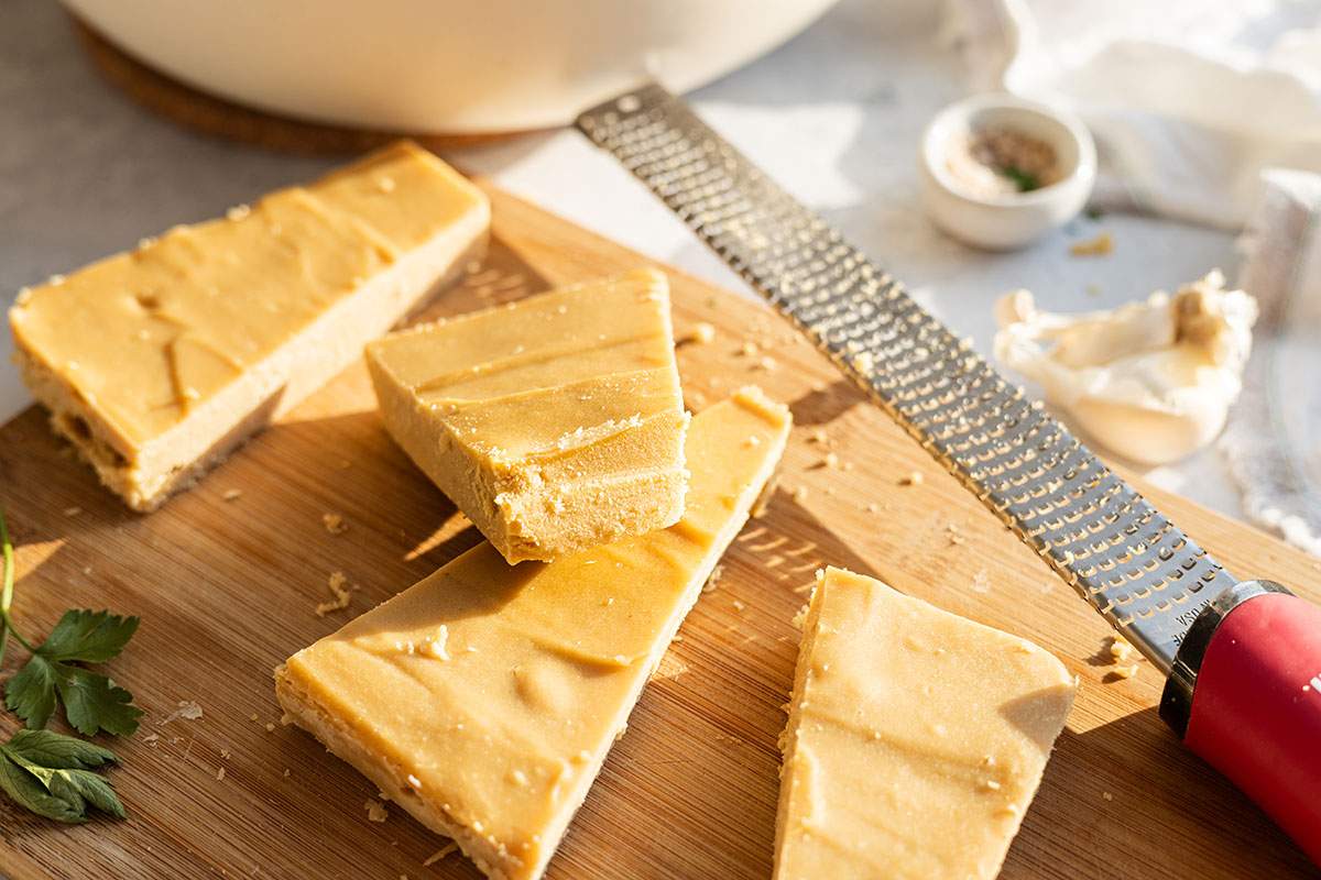 Nutty vegan parmesan on a chopping board.