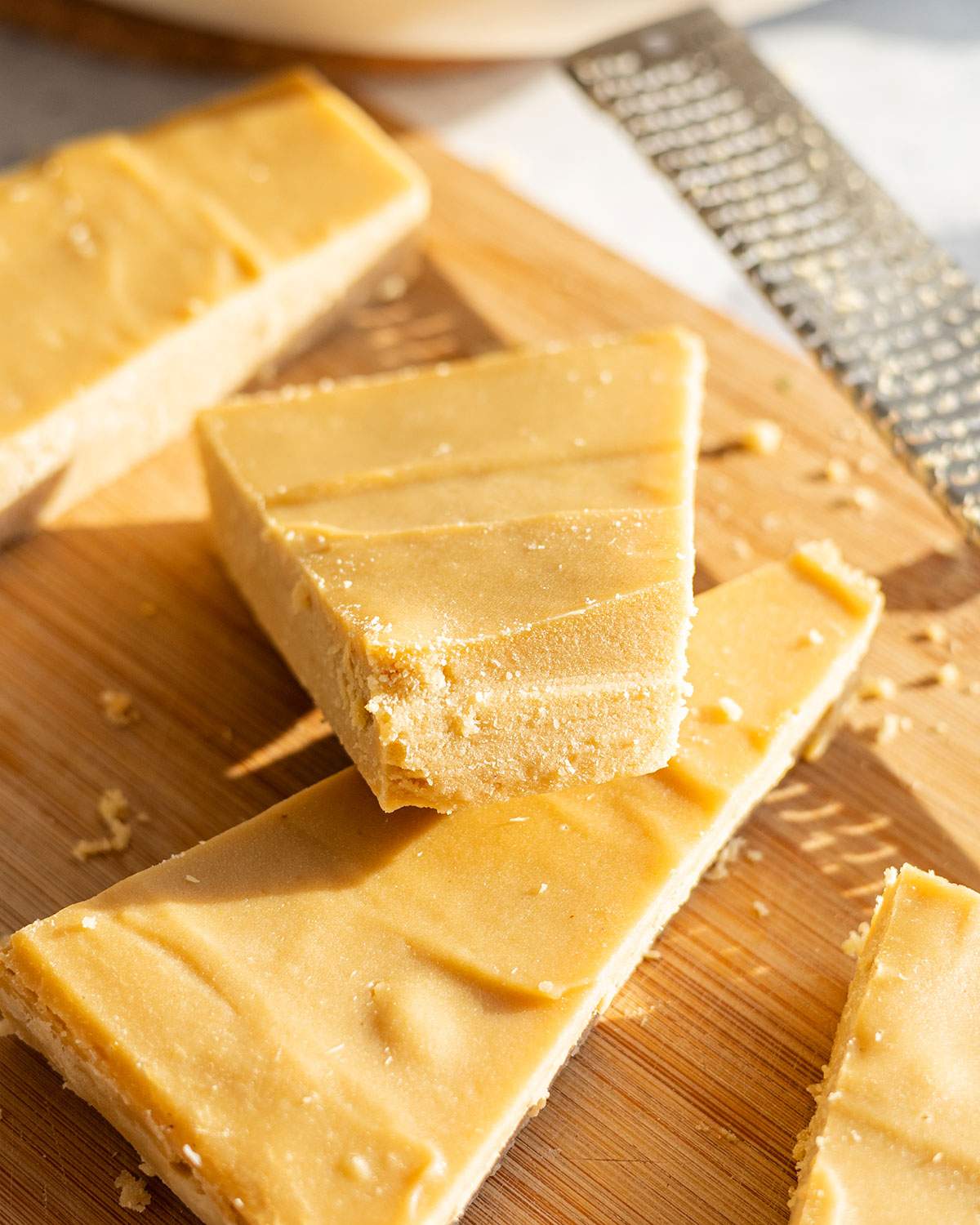 A wedge of vegan parmesan cheese resting on another.