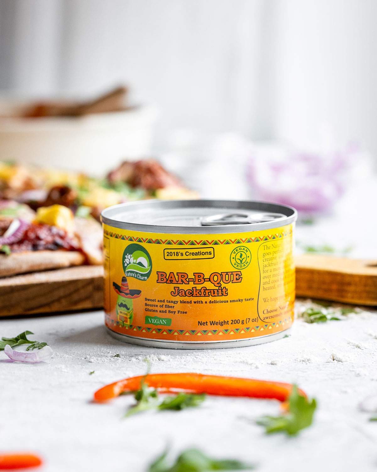 A tin of Nature's Charm BBQ Jackfruit on a table.