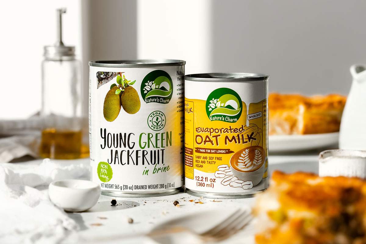 Two tins of Jackfruit and Evaporated Oat Milk from Nature's Charm.