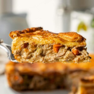 A slice of vegan chicken pot pie seen from the side.