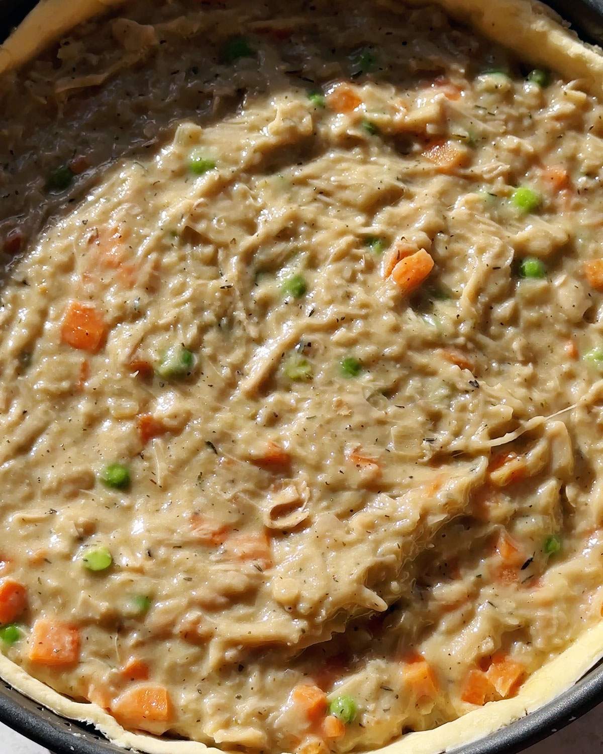 Vegan chicken pot pie filling in pastry crust.