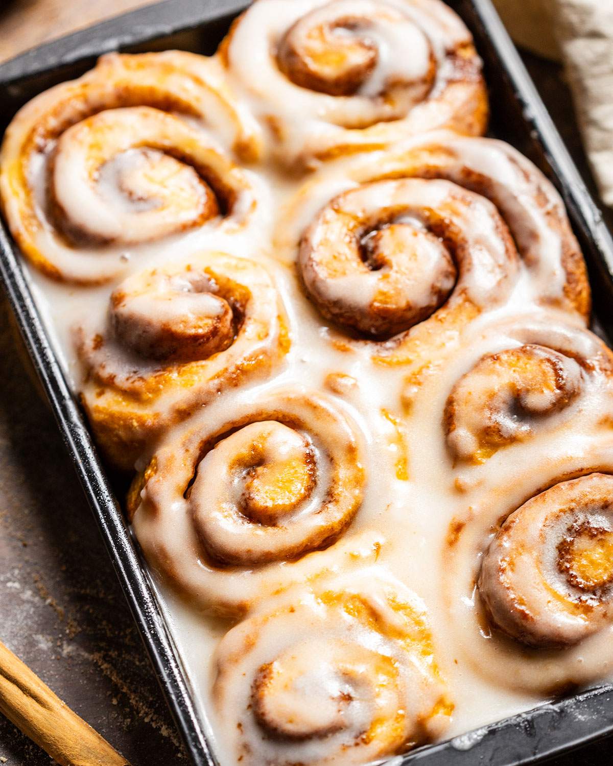 Glazed vegan cinnamon rolls up close.